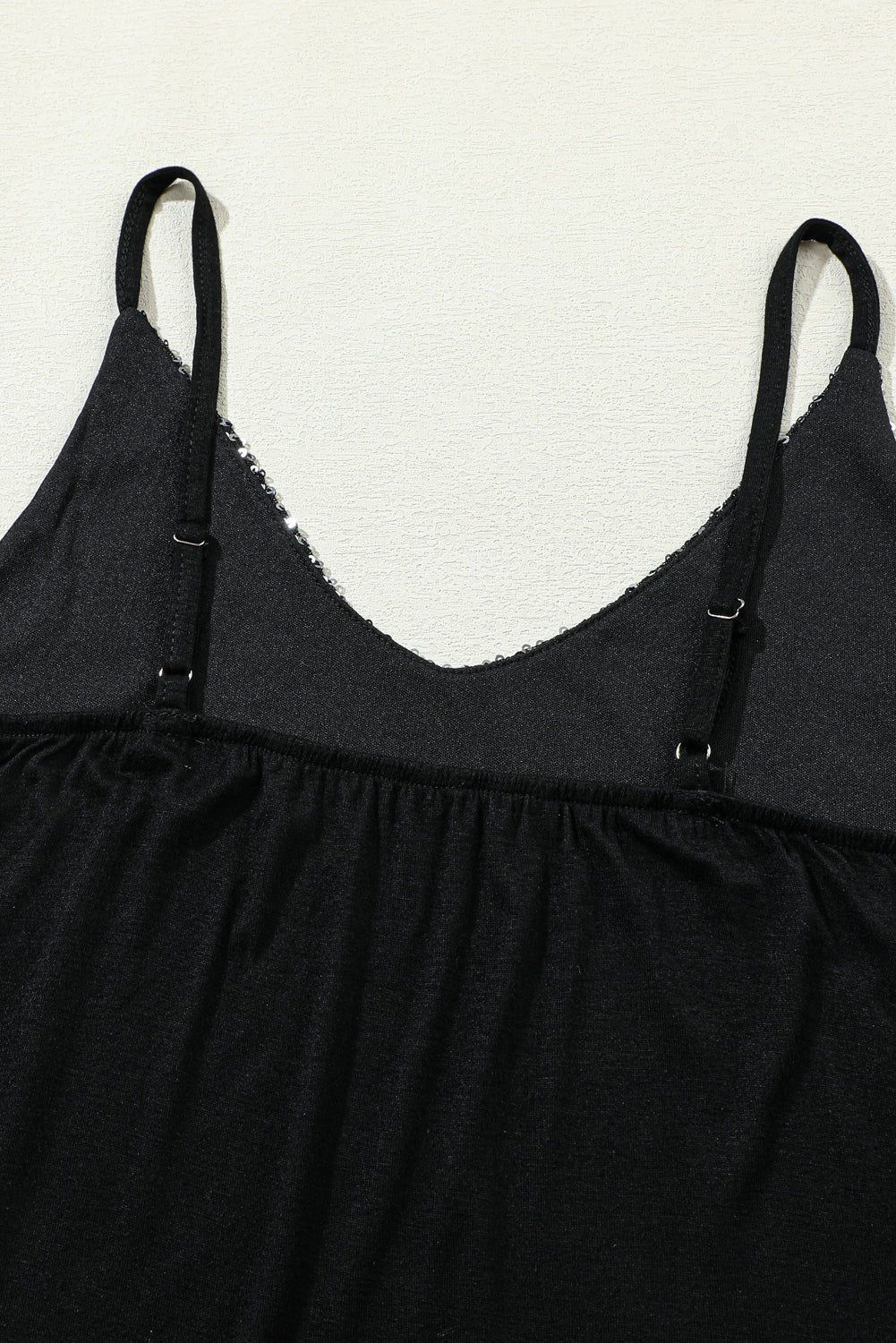 Top gris sin mangas con lentejuelas