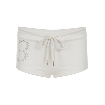 Pantalones cortos de tiro bajo con cordón y pedrería digital