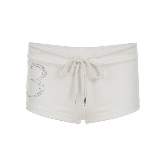 Pantalones cortos de tiro bajo con cordón y pedrería digital