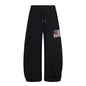 Pantalones deportivos bordados con tejido adhesivo