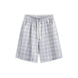 Pantalones cortos de cuadros holgados e informales estilo playero