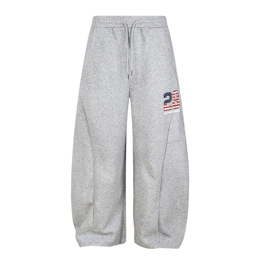 Pantalones deportivos bordados con tejido adhesivo