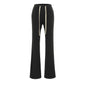 Pantalón de tiro bajo, ajustado, ligeramente acampanado
