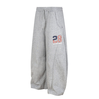 Pantalones deportivos bordados con tejido adhesivo